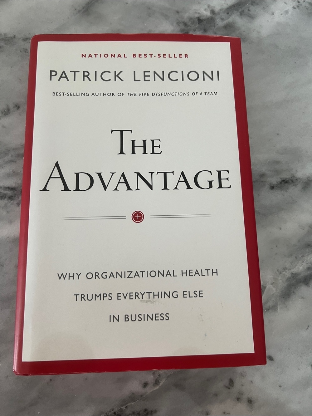 The Advantage by Patrick Lencioni — White & Red Hardcover